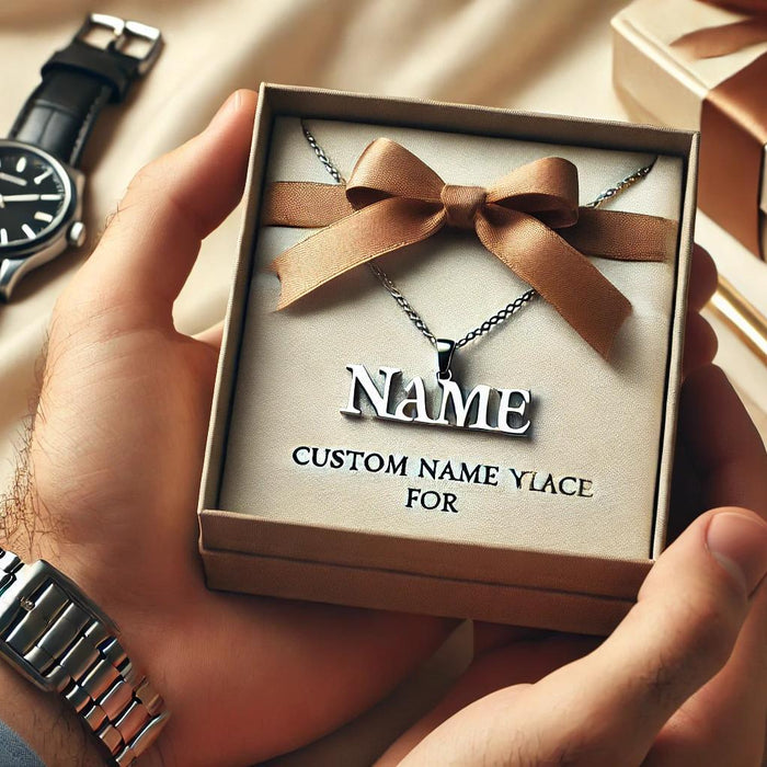 Custom name necklace designed for men, featuring a masculine, sleek design in silver or dark metal, displayed in an elegant gift box. The background includes subtle masculine elements like a wristwatch, conveying the idea of a