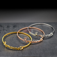 Custom Arabic name bangle bracelet in gold vermeil by Sairahaz