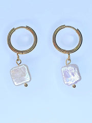 Side view of Natural White Freshwater Baroque Square Hoop Earrings with stainless steel and Akoya pearls