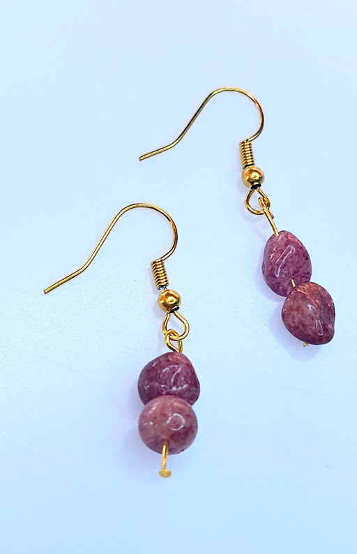 An image of a pair of elegant handmade ruby birthstone earrings, showcasing vibrant red gemstones set in a delicate and stylish design.
