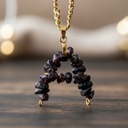 Personalized January garnet initial necklace in a polished gift-ready finish