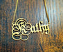 Parchment Quill Custom Name Necklace on wood