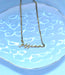 Tiny Minimalist Custom Name Necklace on plate