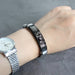 Custom Photo Bracelets Metallic Mesh being worn on a hand, showcasing sleek silver and bold black finishes, customizable with personal photos- Gift for him