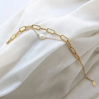 Minimalist pearl paperclip bracelet with a single freshwater pearl accent
