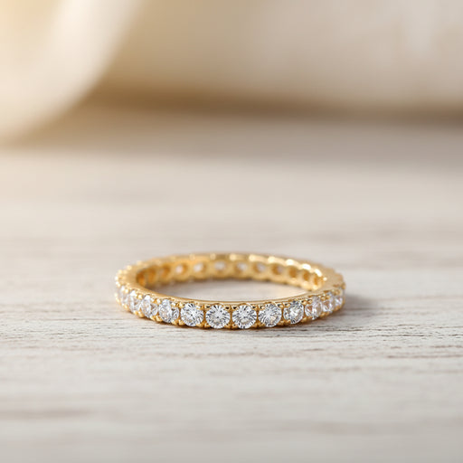 A gold eternity ring with clear round-cut gemstones, shown on a white background with promotional text including 'Adodo Ready to ship' and feature bullet points for nickel-free, eco-friendly, allergy-free, and GRA Certificate.