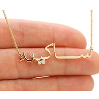 Arabic customized name necklace with CZ accents and a polished script design